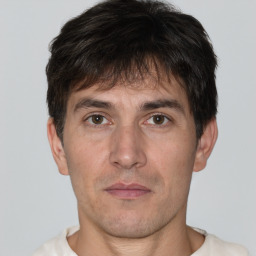 Neutral white adult male with short  brown hair and brown eyes