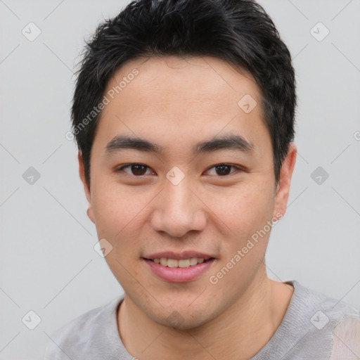 Joyful asian young-adult male with short  brown hair and brown eyes