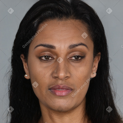 Joyful latino young-adult female with long  brown hair and brown eyes