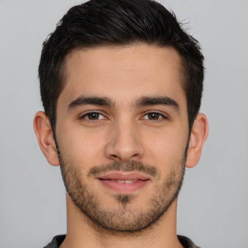 Joyful white young-adult male with short  brown hair and brown eyes