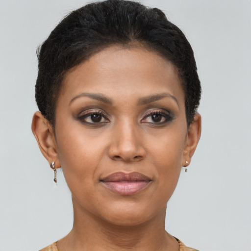Joyful black young-adult female with short  brown hair and brown eyes