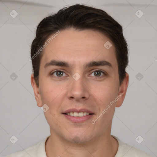 Joyful white young-adult male with short  brown hair and brown eyes