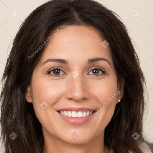 Joyful white young-adult female with long  brown hair and brown eyes