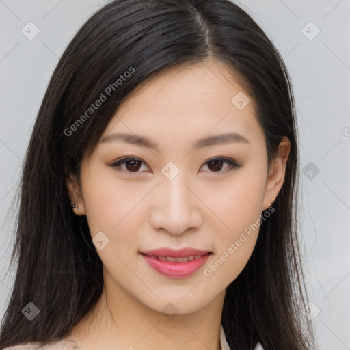 Joyful asian young-adult female with long  brown hair and brown eyes