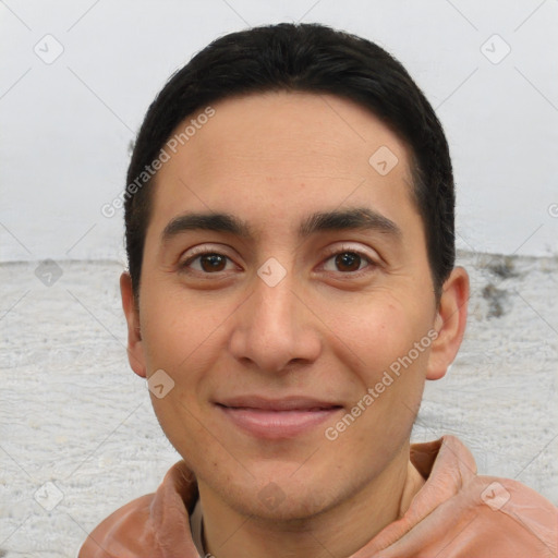 Joyful white young-adult male with short  black hair and brown eyes