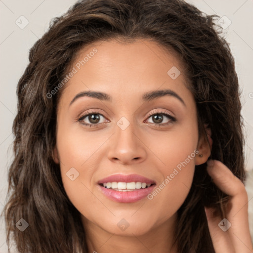 Joyful white young-adult female with long  brown hair and brown eyes