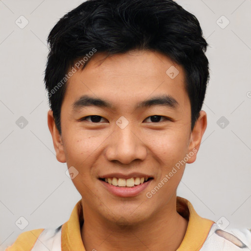 Joyful asian young-adult male with short  black hair and brown eyes