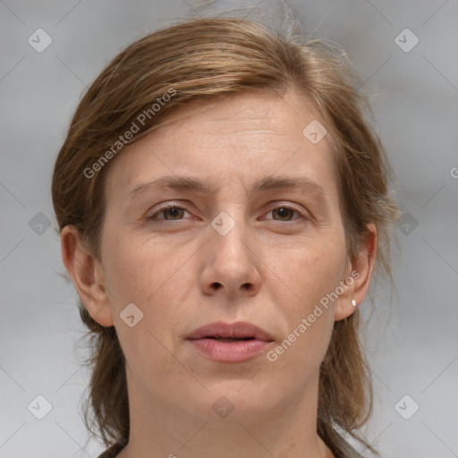 Joyful white adult female with medium  brown hair and grey eyes