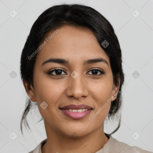 Joyful latino young-adult female with medium  brown hair and brown eyes