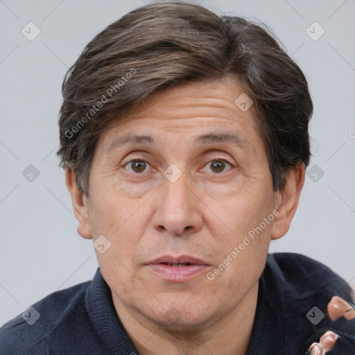 Joyful white middle-aged male with short  brown hair and brown eyes