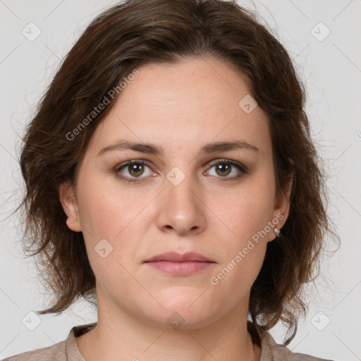 Joyful white young-adult female with medium  brown hair and green eyes