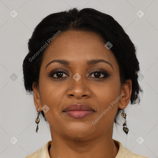Joyful black adult female with short  brown hair and brown eyes