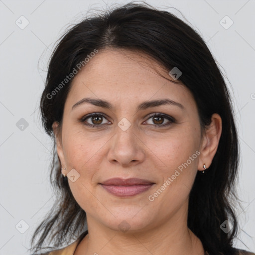 Joyful white adult female with medium  brown hair and brown eyes