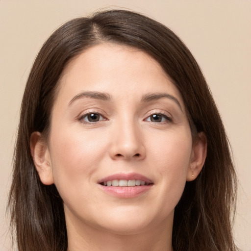 Joyful white young-adult female with long  brown hair and brown eyes