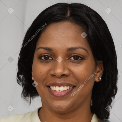 Joyful black young-adult female with medium  black hair and brown eyes