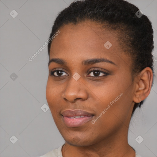 Joyful black young-adult female with short  brown hair and brown eyes