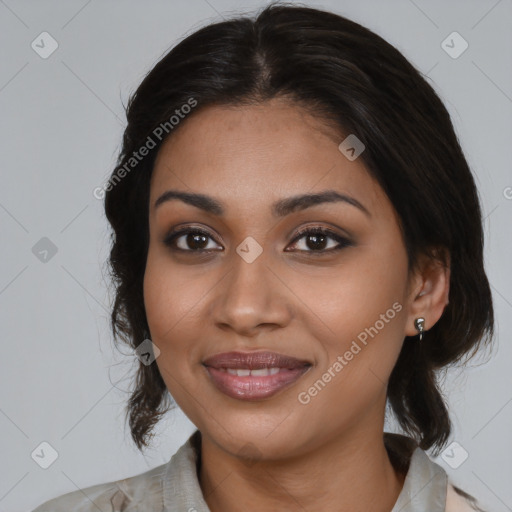 Joyful latino young-adult female with medium  brown hair and brown eyes