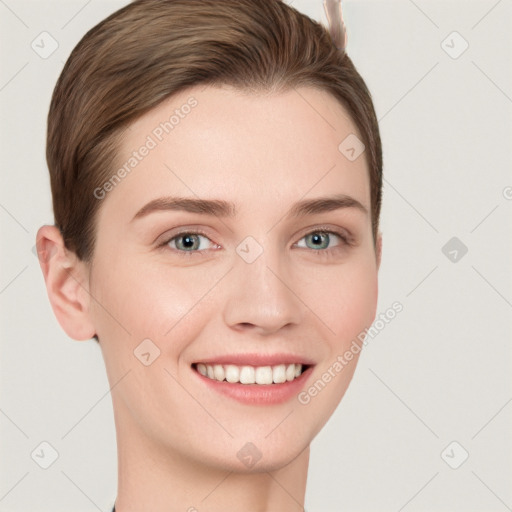 Joyful white young-adult female with short  brown hair and grey eyes