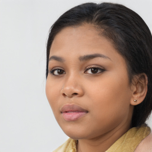 Neutral latino young-adult female with medium  brown hair and brown eyes