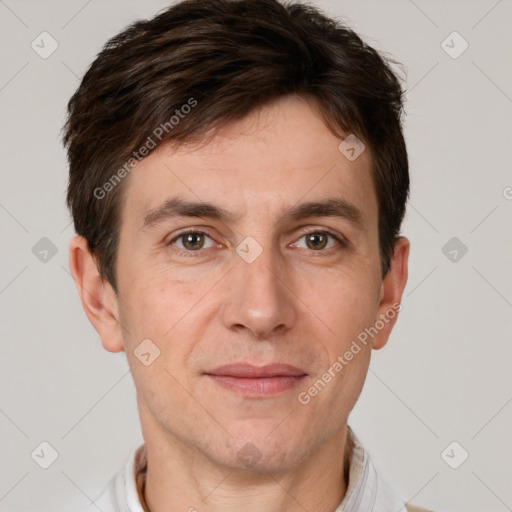 Joyful white adult male with short  brown hair and brown eyes