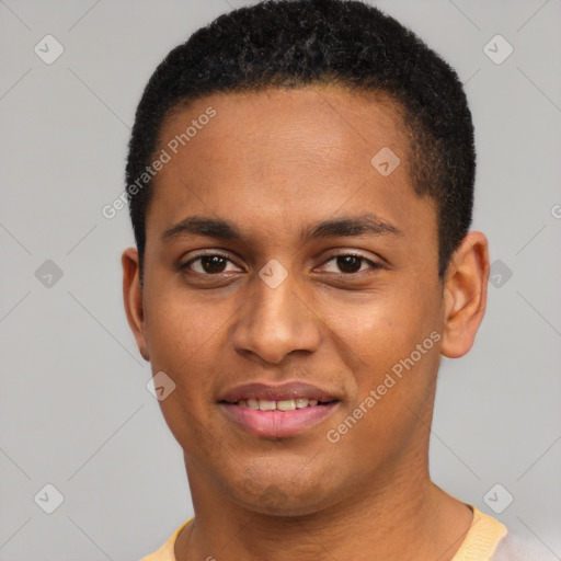 Joyful black young-adult male with short  black hair and brown eyes