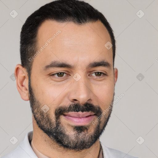 Joyful white young-adult male with short  black hair and brown eyes