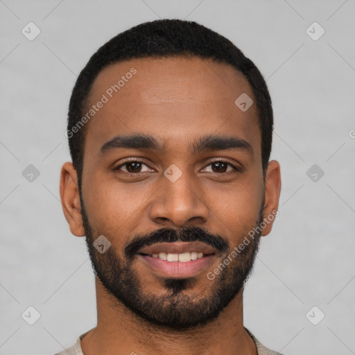 Joyful black young-adult male with short  black hair and brown eyes