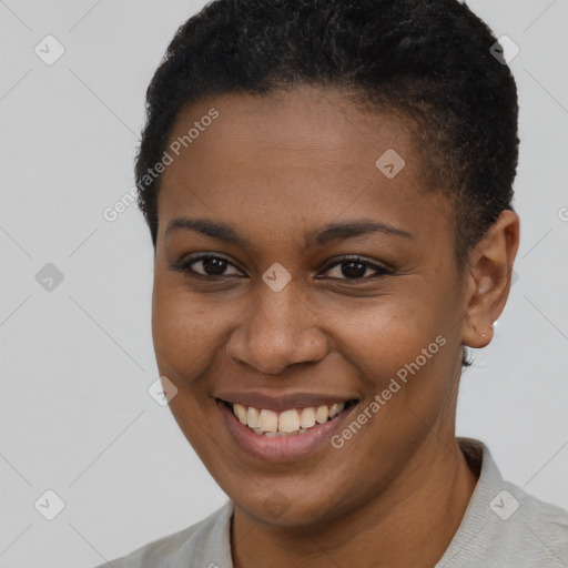 Joyful black young-adult female with short  brown hair and brown eyes