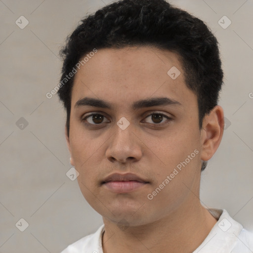 Neutral latino young-adult male with short  black hair and brown eyes