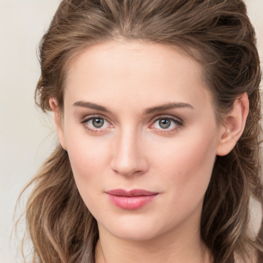 Neutral white young-adult female with medium  brown hair and green eyes