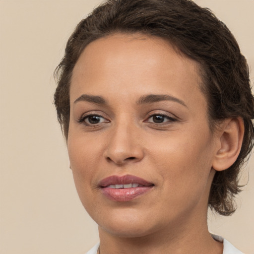 Joyful white young-adult female with medium  brown hair and brown eyes