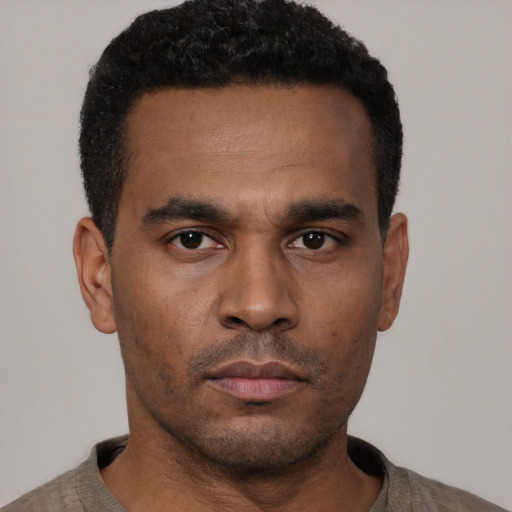 Neutral black young-adult male with short  black hair and brown eyes