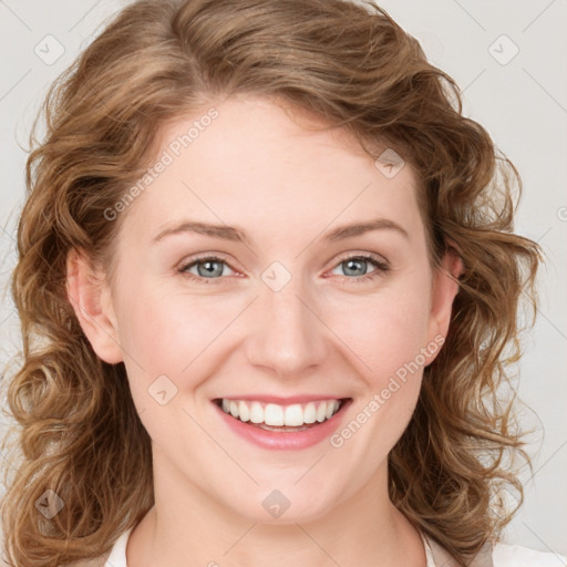 Joyful white young-adult female with medium  brown hair and blue eyes