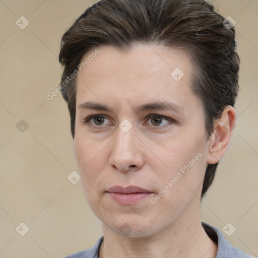 Joyful white adult female with short  brown hair and brown eyes