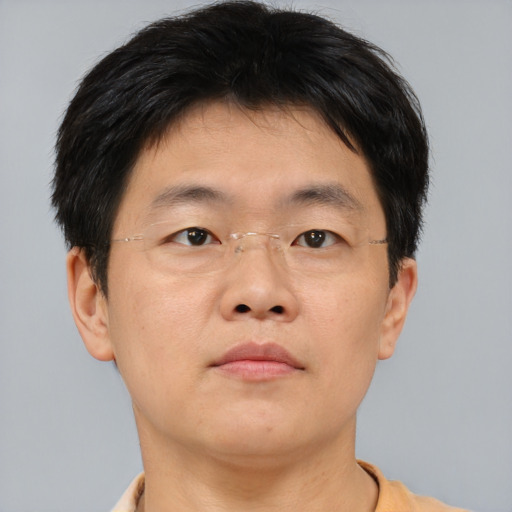 Neutral asian adult male with short  brown hair and brown eyes