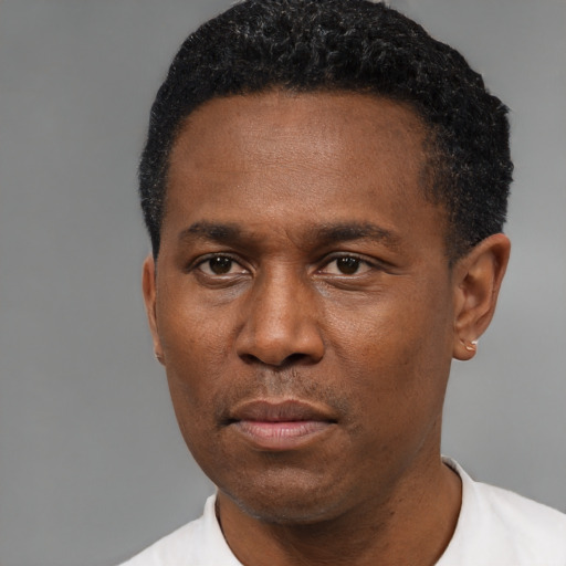 Neutral black young-adult male with short  black hair and brown eyes
