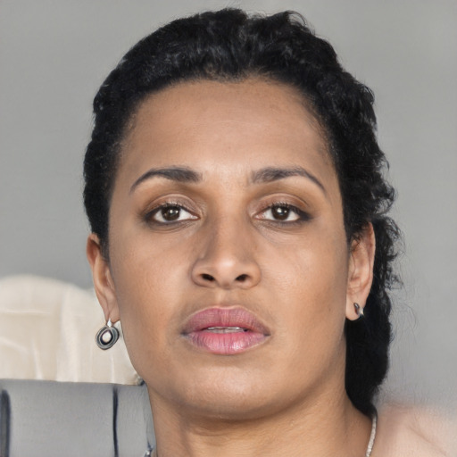 Neutral black young-adult female with long  black hair and brown eyes