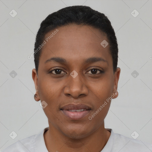 Joyful black young-adult female with short  black hair and brown eyes