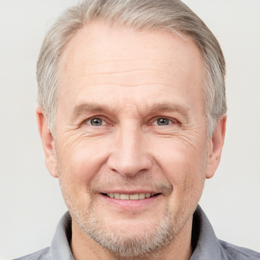 Joyful white middle-aged male with short  gray hair and grey eyes