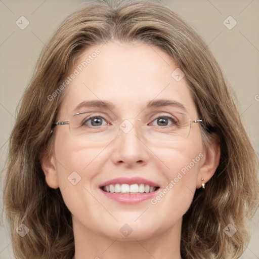 Joyful white adult female with medium  brown hair and green eyes