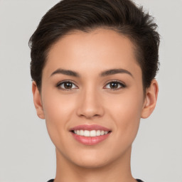 Joyful white young-adult female with short  brown hair and brown eyes