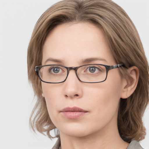 Neutral white young-adult female with medium  brown hair and grey eyes