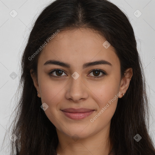 Joyful latino young-adult female with long  brown hair and brown eyes