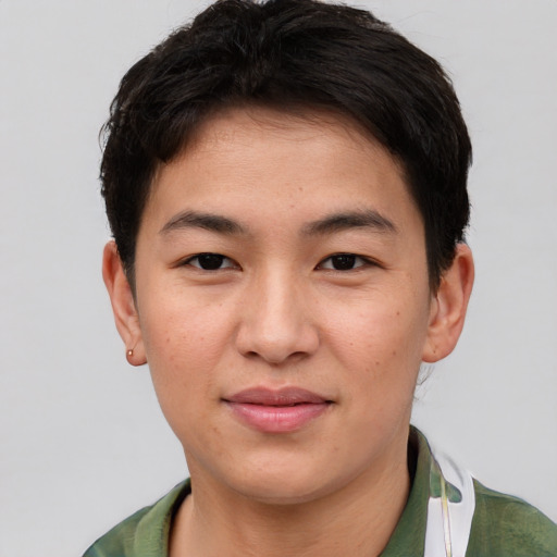 Joyful asian young-adult male with short  brown hair and brown eyes
