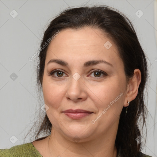 Joyful white adult female with medium  brown hair and brown eyes