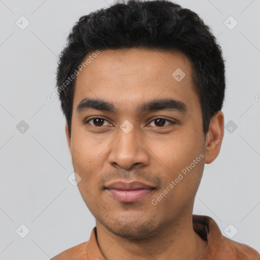 Joyful latino young-adult male with short  black hair and brown eyes