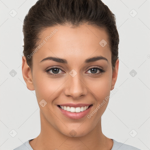 Joyful white young-adult female with short  brown hair and brown eyes