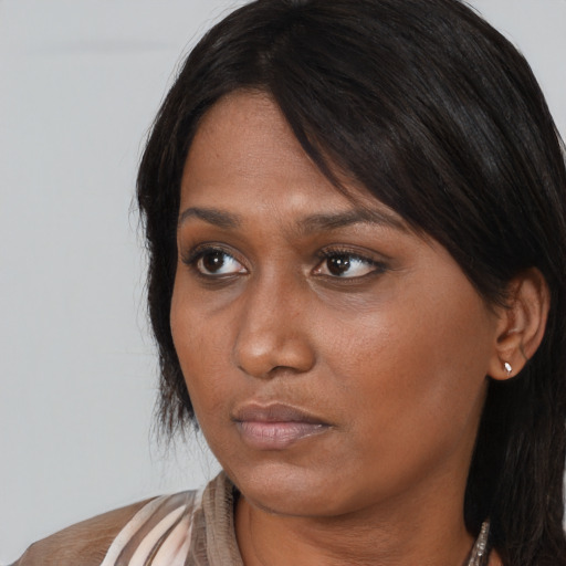 Neutral asian young-adult female with medium  black hair and brown eyes