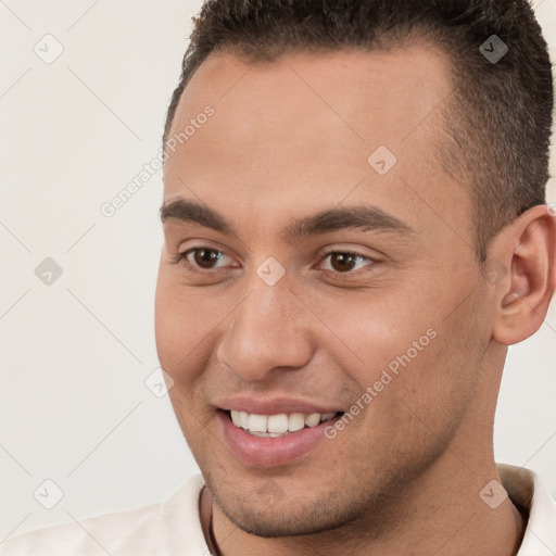 Joyful white young-adult male with short  brown hair and brown eyes