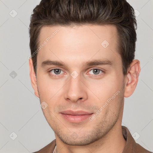 Joyful white young-adult male with short  brown hair and brown eyes